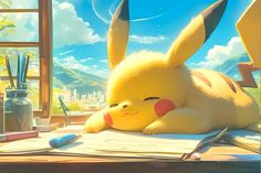 a pikachu laying on top of a desk in front of a window next to a pen and pencil