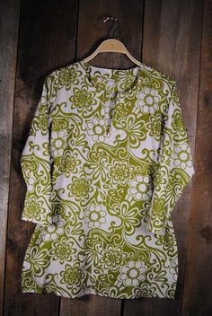 This cotton print tunic has the avocado trending color of the season on a white, light weight cotton fabric. 100% cotton v-neck, side slits, quarter sleeves, mi Cotton Tunic With Printed Motifs For Summer, Casual Cotton Tunic With 3/4 Sleeves, Printed V-neck Tunic, Bohemian V-neck Tunic With Floral Print, Green Floral Print V-neck Tunic, New Rochelle, Print Tunic, Quarter Sleeve, Color Trends