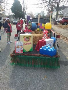 the float is decorated with toys and decorations for children's birthdays on the street