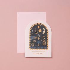 a black and gold birthday card on a pink background with an arch - shaped window