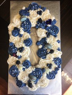 a cake decorated with blue and white flowers