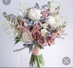 a bridal bouquet with pink and white flowers