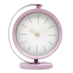 a small pink and white clock on a stand