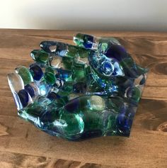 a glass bowl sitting on top of a wooden table