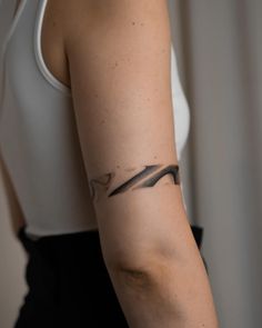 a woman with a tattoo on her arm