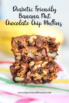 three chocolate chip muffins stacked on top of each other with bananas in the background