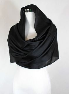 Black silk shawl, Solid Black formal scarf, 14"x72" scarf, Solid black silk scarf, ready to ship, habotai silk scarf, black silk scarf.Product information:Designer - Mary Jane DavidsonMaterial- 100 % natural 8mm Habotai silkColor - Solid BlackSize - 14"x72" slight shrinkage may occur from steamingPackage - Envelope or gift packageEach scarf is unique and it is a true piece of wearable art, no one else is going to have the same scarf like you! Each scarf is painted by me one at a time and so slig Classic Black Silk Scarf, Classic Black Silk Scarves, Elegant Black Silk Scarf For Formal Occasions, Classic Silk Scarves For Evening, Elegant Silk Scarves With Satin Finish, Elegant Black Shawl Scarves, Formal Black Shawl Scarves, Elegant Black Silk Scarves, Classic Silk Evening Scarf