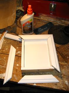 the paint is being applied on the white cabinet doors