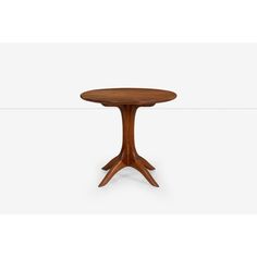 a small wooden table with two legs and a round top, on a white background