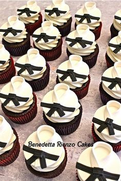 cupcakes decorated with black ribbon and bow ties