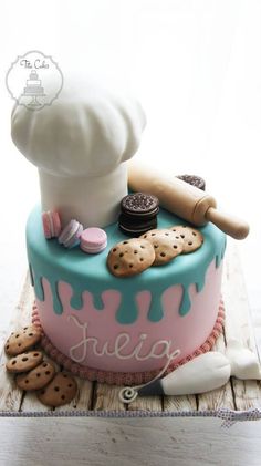 a cake decorated with cookies and doughnuts on top of a wooden table next to an instagram post