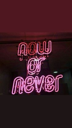 a neon sign that says now or never