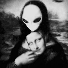 a woman with an alien mask on her head holding another woman's face in front of the camera