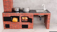 an outdoor brick oven with pots and pans on the stove top, next to a sink