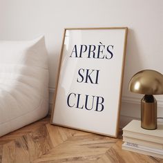 there is a sign that says apres ski club next to a lamp on the floor