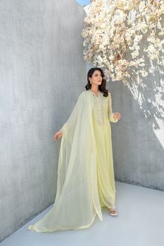 SKU: 2210 Price for Shirt, lining & Pants The lemon colored chiffon long maxi is garnished with hand french knot details and luxurious crystals and pearl work. The thread work on collar with pearls gives this ensemble a formal wear for any festive occasion. Dupatta as is can be added. Lemon Color Dress, Lemon Colour Dress, Pakistani Designer Dress, Lemon Color, Dress Pakistani, Pearl Work, Asian Wedding Dress, Lemon Dress, French Knot