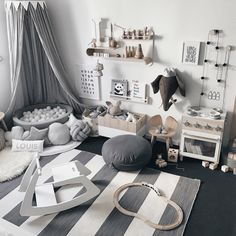 a child's bedroom with lots of toys and accessories on the floor, including a bed