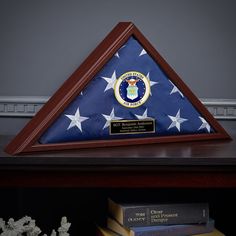 an american flag and books on a shelf