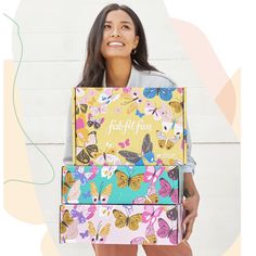 a woman holding two boxes with butterflies on them and the words, fresh fit fun