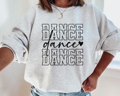 Dance Sweatshirt This crewneck sweatshirt is pure comfort. Made from a soft cotton/poly blend with no itchy side seams, this is sure to become a staple. SIZE AND FIT: Your sweatshirt design will be printed on a high-quality, soft and comfortable unisex sweatshirt. Sizes run true to size, which takes the guesswork out of ordering; if you like your sweatshirts loose or oversized, you might want to order a size up and if you'd like a more fitted women's style then order a size down. Please refer to Dance Sweatshirt Ideas, Dance Team Tshirt Designs, Crew Neck Sweatshirt With Letter Print For Dance, Hip Hop Long Sleeve Sweatshirt For Dance, Graphic Print Crew Neck Sweatshirt For Dance, Crew Neck Graphic Print Sweatshirt For Dance, Casual Letter Print Sweatshirt For Dance, Casual Tops For Dance Class In Fall, Casual Tops For Dance In Fall