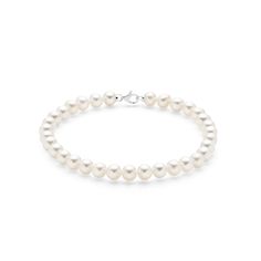 Discover the classic beauty of this elegant freshwater pearl bracelet, adorned with 5mm natural pearls and an 18K white gold lobster clasp. The slightly larger pearls offer a more pronounced statement while maintaining a timeless look that suits any style. Whether worn alone or stacked with other bracelets, this piece enhances your ensemble with its graceful charm. The high-quality white gold clasp ensures durability and security, making it a perfect choice for everyday wear or special occasions Timeless Silver Pearl Bracelets, Elegant Pearl Chain Beaded Bracelet For Formal Occasions, Elegant White Gold Beaded Bracelets For Anniversary, Elegant Pearl Bracelet With Sterling Silver Clasp, Elegant White Gold Pearl Bracelet With Sterling Silver Clasp, Elegant White Gold Pearl Jubilee Bracelet, Timeless White Gold Pearl Bracelet For Anniversary, Timeless White Gold Pearl Bracelet, Elegant Sterling Silver Oyster Bracelet For Formal Occasions