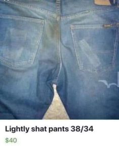 a pair of blue jeans that are sitting on top of each other in front of a person's stomach