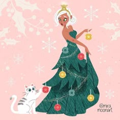 a woman in a green dress is standing next to a white cat and christmas tree