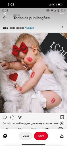 a baby with red paint on it's face laying down