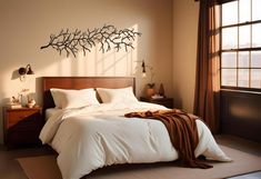 a bed with white sheets and pillows in a bedroom