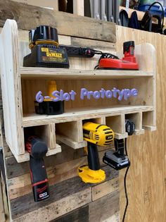 some tools are sitting on shelves in a workshop