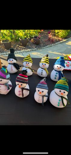 several snowmen are lined up on the ground