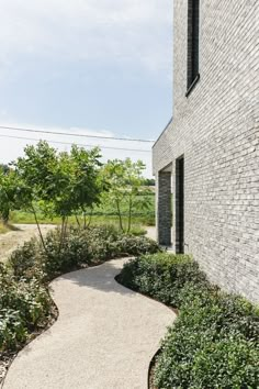 a brick building with a walkway leading to it