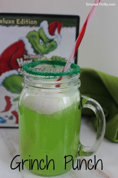 a green drink in a mason jar with a straw