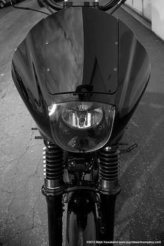 black and white photograph of the front end of a motorcycle