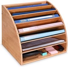 a wooden desk organizer holds many files and folders