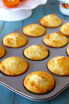 muffins in a baking pan on a blue table