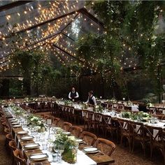 an indoor venue with tables and chairs set up for dinner