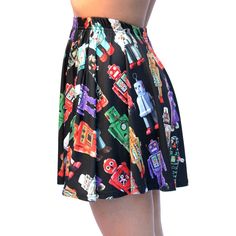 "HOLIDAY DEADLINES USA customers: Please order by Tues. Dec. 1st. Expedite by Mon. Dec. 9th. No guarantee after those dates. Outside USA no guarantee even with expedited shipping, sorry. \"Take me out dancing\", said the robot skirt. And you will look so good in this mini skirt, you'll do what it says. I photographed my vintage tin robot collection and designed my very own exclusive fabric. The printed colors are incredibly vivid and rich, even better than I could have imagined! This comfortable Retro Black Mini Skirt With Lining, Fitted Black Printed Skirt, Dec 1st, Mini Skirt Black, The Robot, Take Me Out, Full Circle, Vintage Tin, Skirt Black