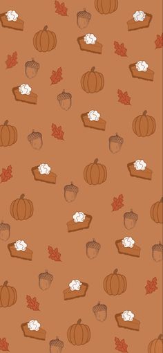 an orange background with pumpkins and other autumn items on it, including marshmallows