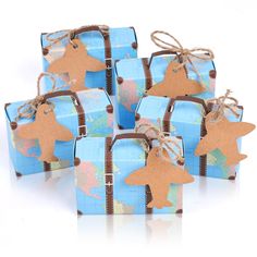 blue gift boxes with brown bows and tags on them