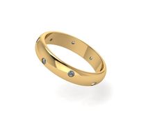 a yellow gold wedding ring with diamonds