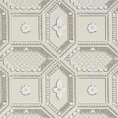 a blue and white wallpaper with an ornate design on it's surface,