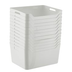 a stack of white plastic containers sitting on top of each other