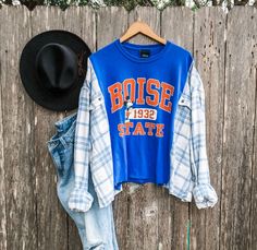 "Boise T-Shirt + Flannel Rework BOISE STATE Sizing: Sizing is very forgiving on these pieces. They are created to be a more oversized fit. Please see measurements and approximate sizing below. APPROXIMATE SIZE for this particular rework: Will fit sizes SMALL - 2XL  PLEASE be sure to measure yourself with the provided measurements below and keep in mind that these are supposed fit a bit more oversized. *We also slightly crop some of our pieces so please be sure you are comfortable with the should Upcycle Clothes Projects, Upcycled Long Sleeve Tops For Fall, Upcycle Flannel Shirt Diy, Tshirt Rework, Diy Flannel Shirt Refashion, Upcycled Fashion Diy Ideas, Upcycle Flannel Shirt, Upcycled Clothing Ideas, Flannel Rework