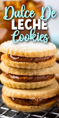 a stack of cookies sitting on top of a cooling rack with the words, dulce de leche cookies