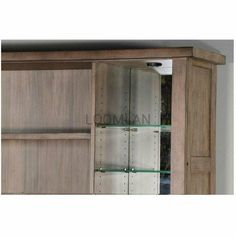 a wooden cabinet with glass shelves in it