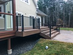 a house with a deck and metal railing