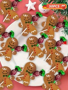 gingerbread cookies on a plate with christmas decorations and candy canes in the background