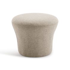 a round ottoman sitting on top of a white floor