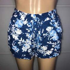 Bebop Blue Floral Shorts New With Tags Length: 11 Inches Beach Floral Print Stretch Shorts, Stretch Floral Print Beach Shorts, Stretch Floral Print Shorts For Beach, Beachy Spring Bottoms Short Length, Blue Stretch Beach Shorts, Blue Summer Shorts With Elastic Waistband, Stretch Blue Beach Shorts, Stretch Floral Print Shorts For Vacation, Blue Elastic Waistband Shorts For Summer